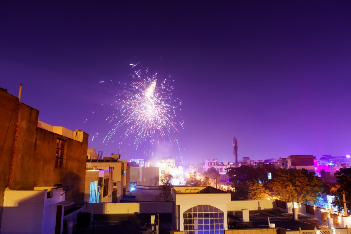 Colorful bursts above rooftops, raising the question of whether there are silent fireworks